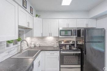 Fully furnished kitchen with stainless steel appliances